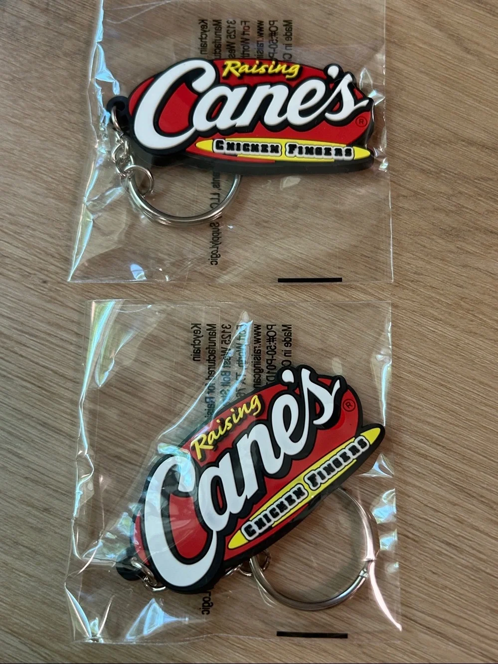 Raising Cane's Red Logo Lanyard with 2 Raising Cane’s Keychains bundle NEW